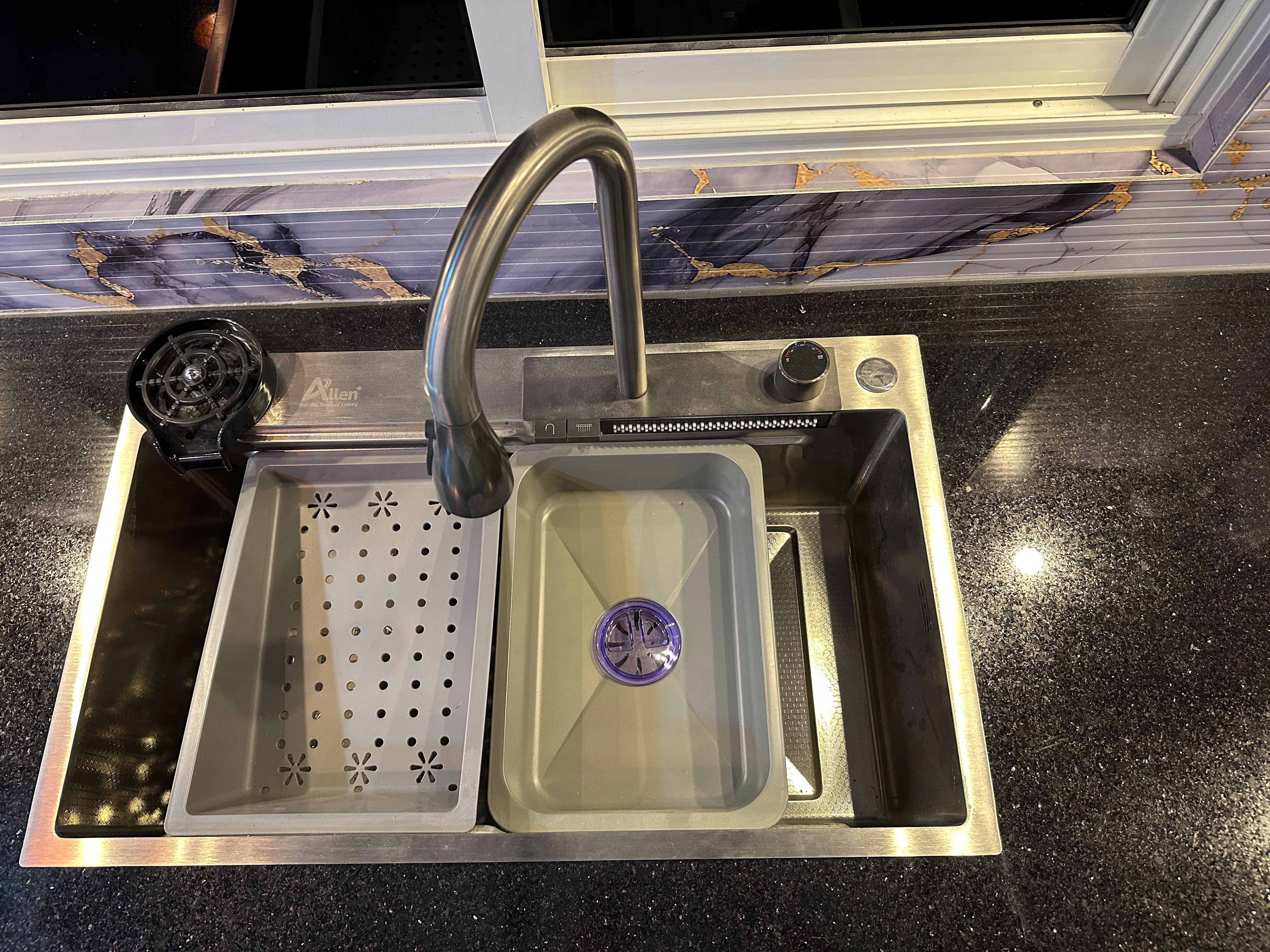 Inset kitchen sink with modern tap